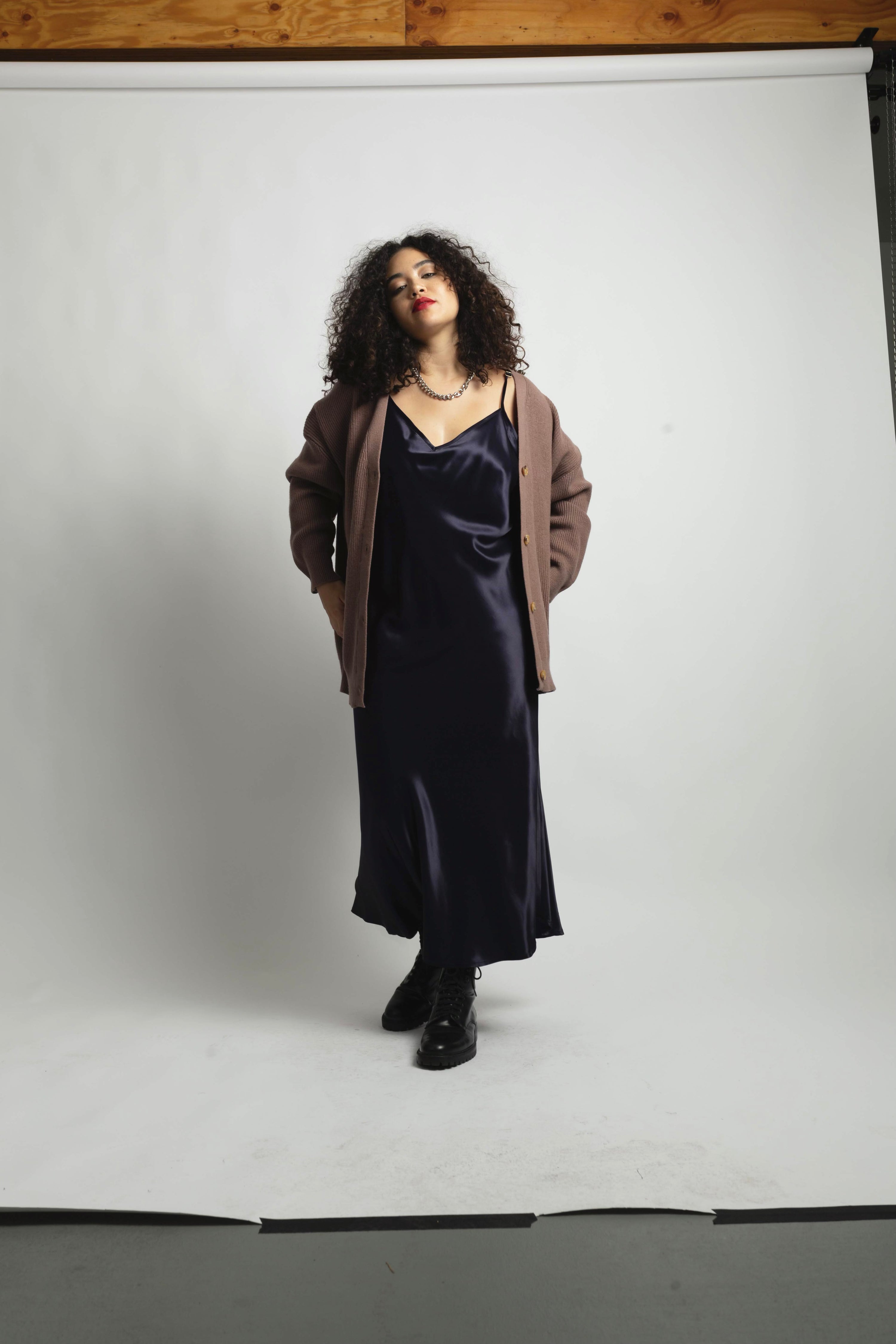 model wearing the deep navy cabaret slip with cardigan