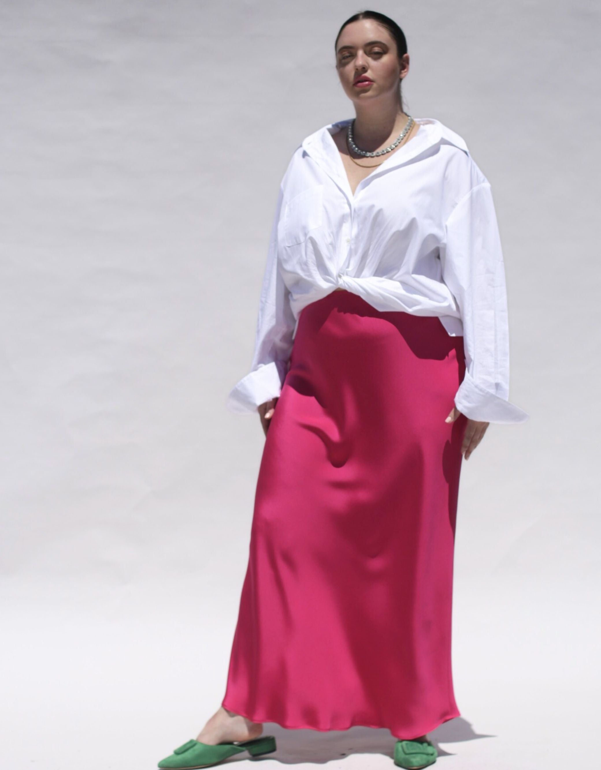 This Sapphire Pink silk slip skirt is cut on the bias for a fluid finish and falls elegantly to the ankle. Model Image