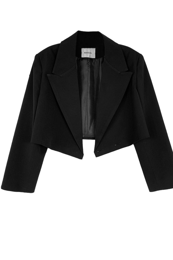 The Crop Blazer is offered here in a rich black. The best Item to update your Fall wardrobe. Perfect to wear open or closed with inside hidden buttons.