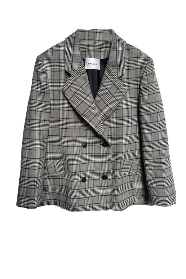 Double Breasted Blazer has a slightly oversized fit. Looks great open belted or buttoned up. Made of a lightweight Wool blend, double-breasted with tailored shoulders. A go-anywhere wear any way favorite you will reach for from Fall through Spring.
