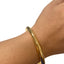 gold bangle on model