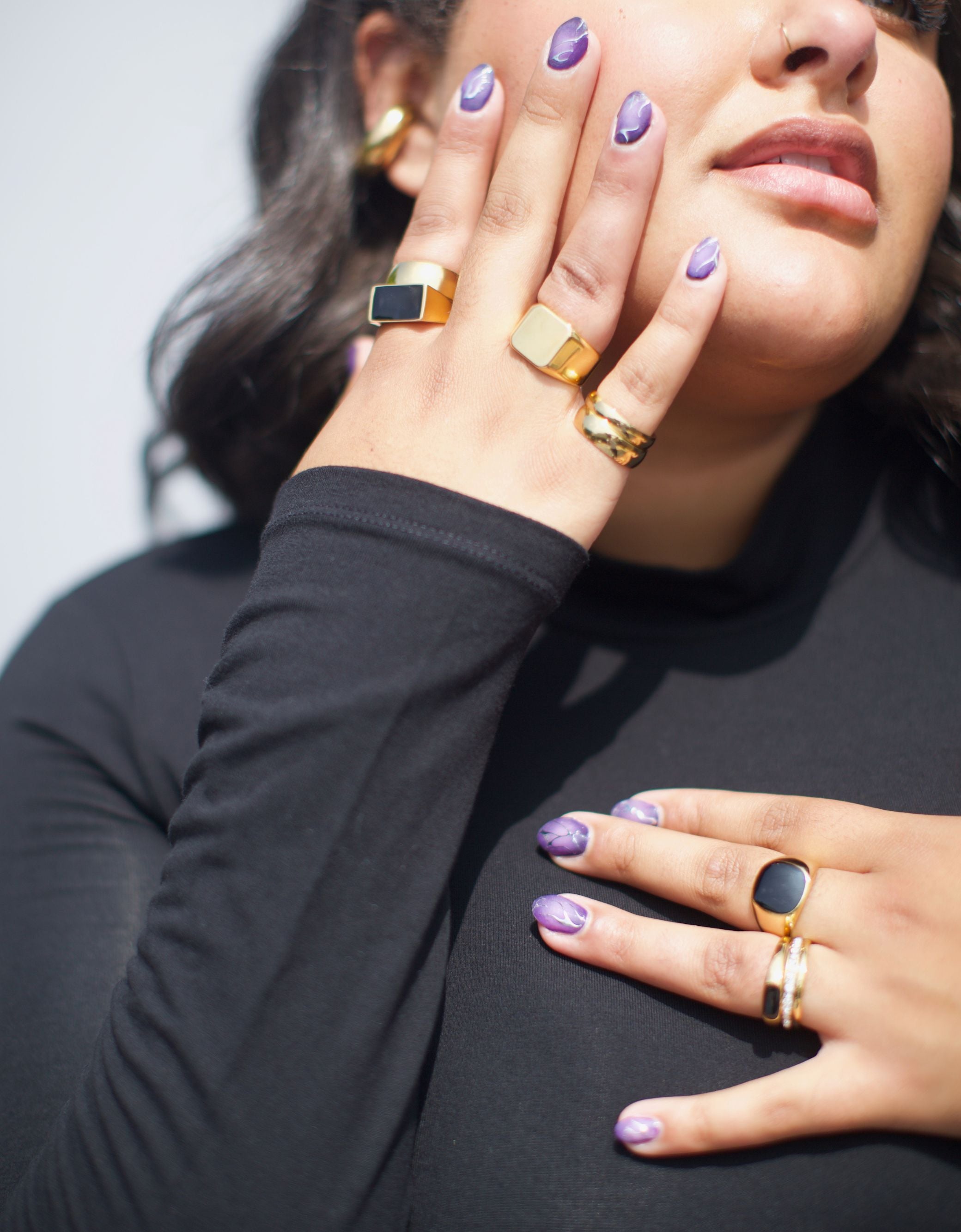 model wearing signet rings