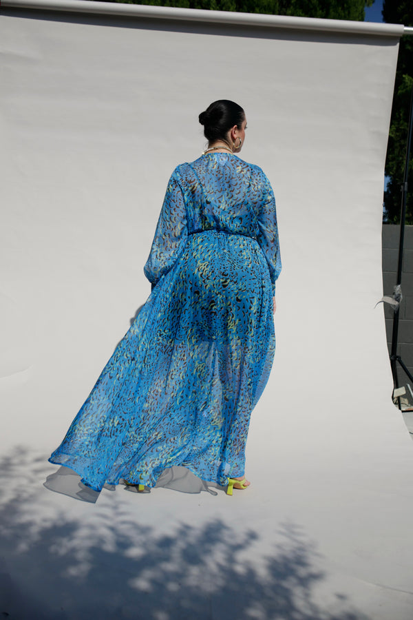 Our best-selling, now classic, maxi wrap dress! The luxurious blue silk chiffon gives this dress a very unique, flowy look. Wear with our navy slip dress or on its own for a sheerly fantastic look. Designed to fit the "True Size Majority" sizes 10-22+