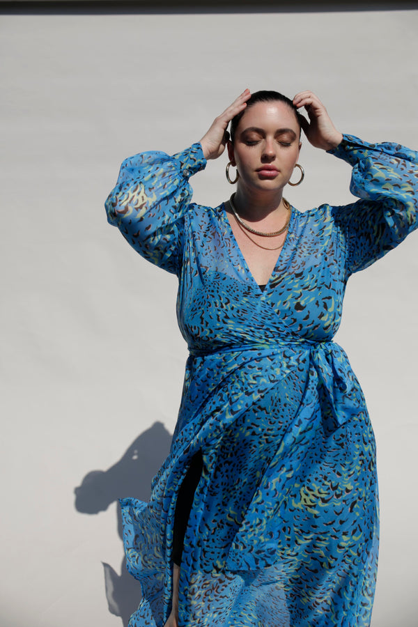 Our best-selling, now classic, maxi wrap dress! The luxurious blue silk chiffon gives this dress a very unique, flowy look. Wear with our navy slip dress or on its own for a sheerly fantastic look. Designed to fit the "True Size Majority" sizes 10-22+