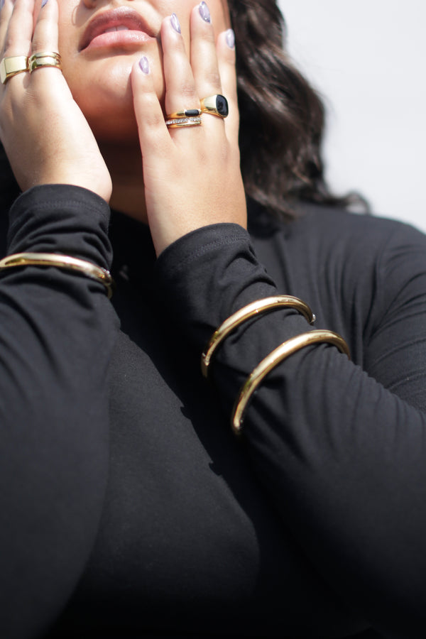 bangles on model touching her face