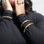 bangles on model touching her face