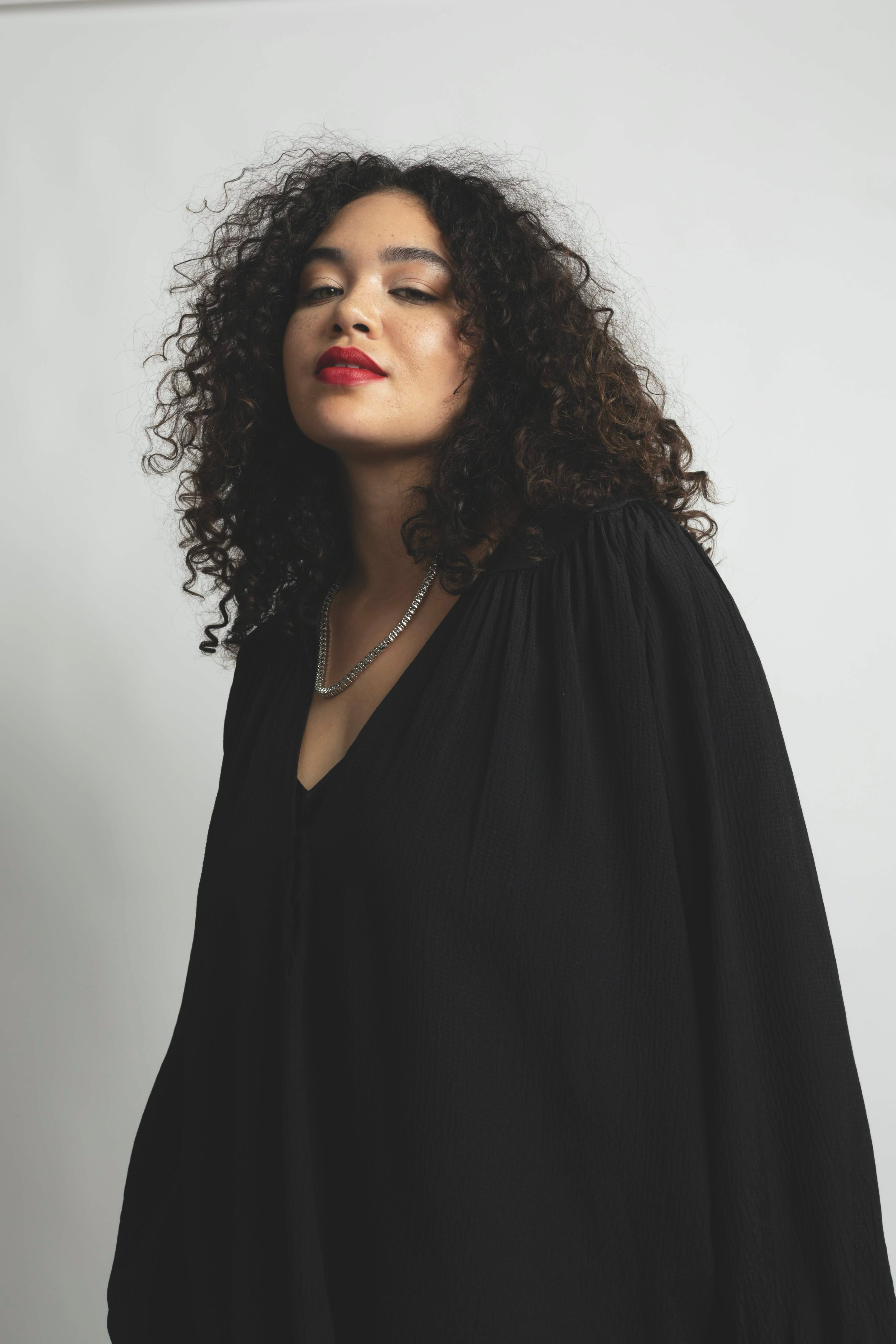 Plus size model wearing textured Stevie top