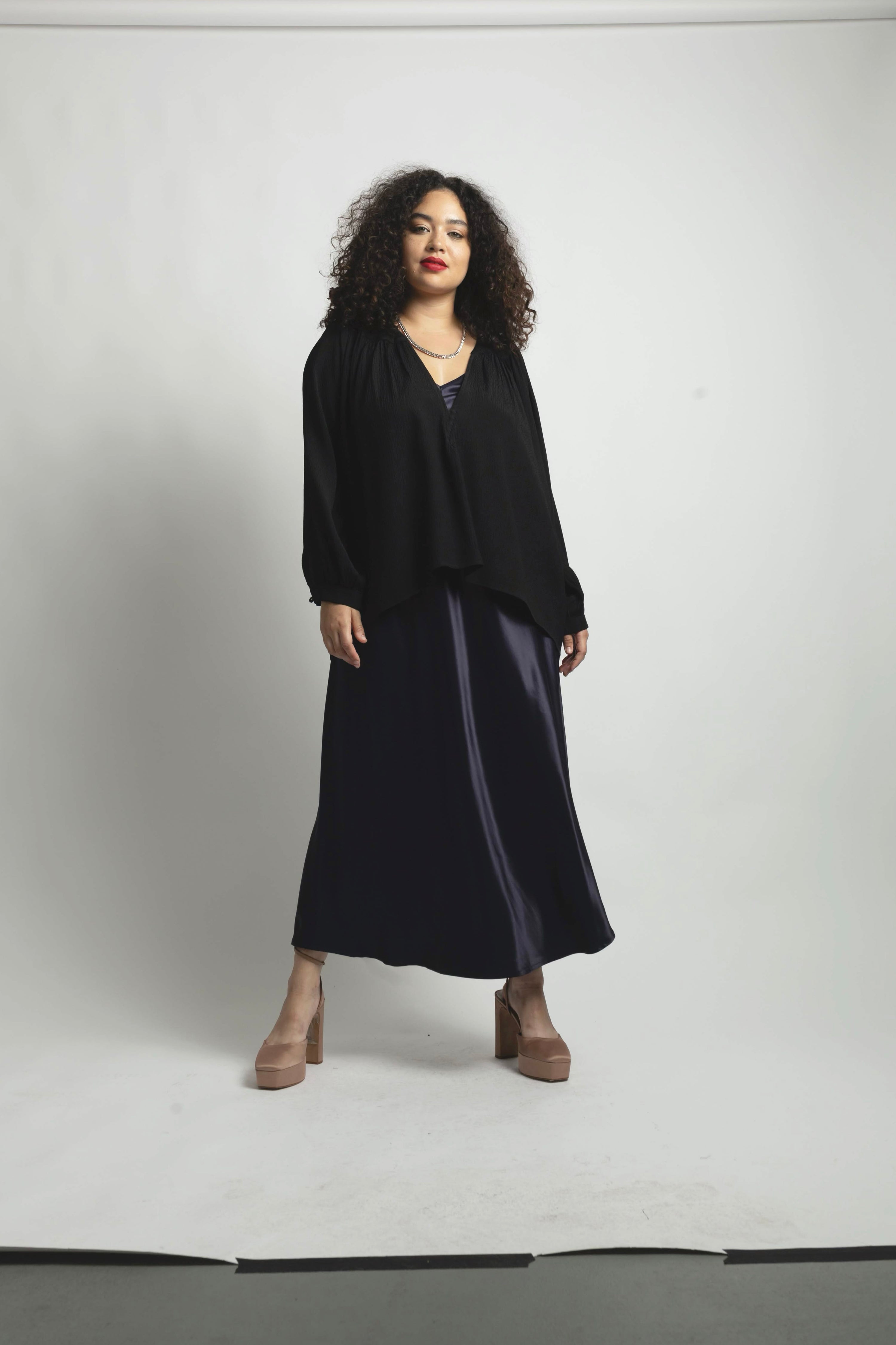 Plus size model wearing textured Stevie top