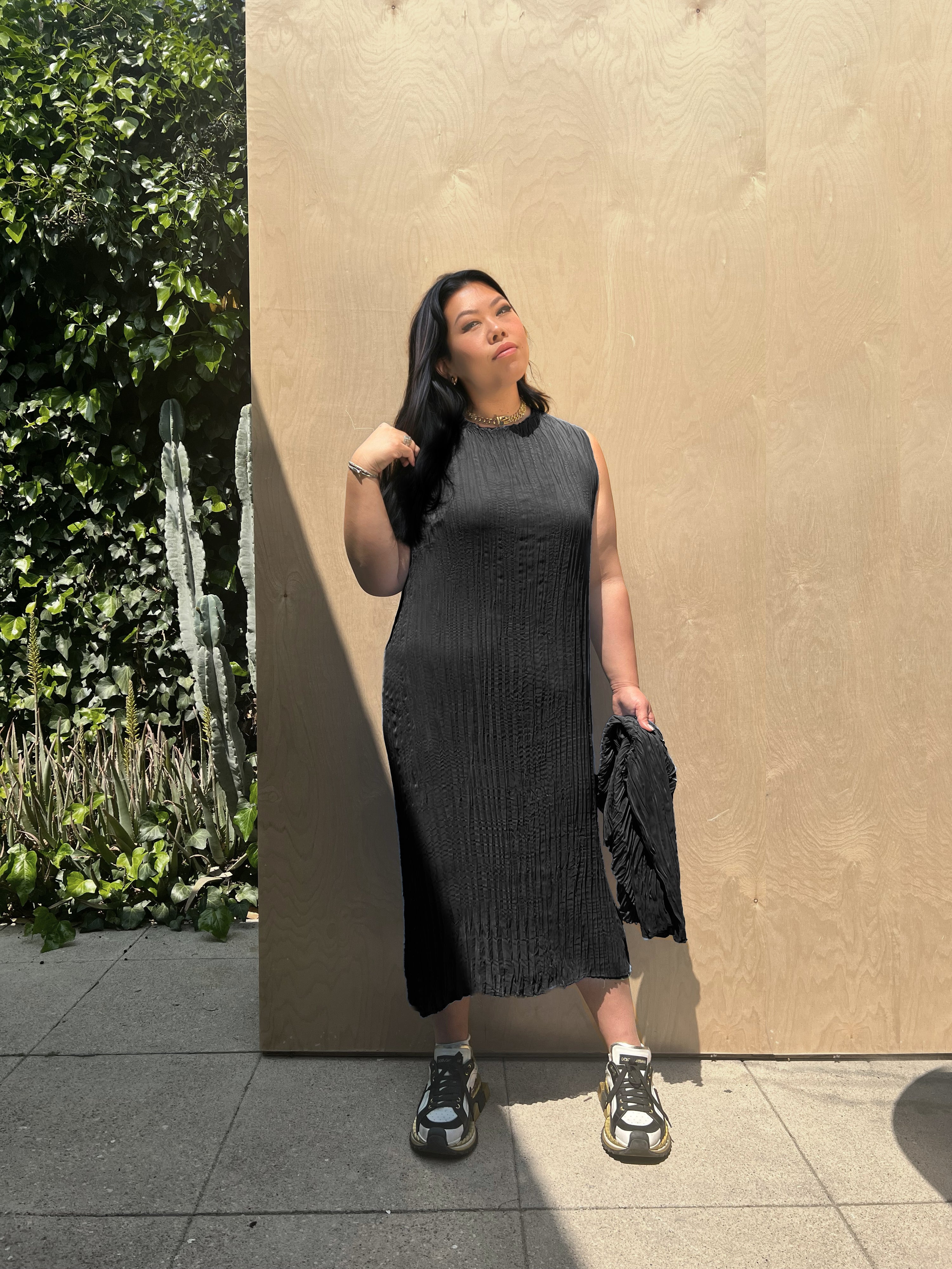 model wearing the pleated dress