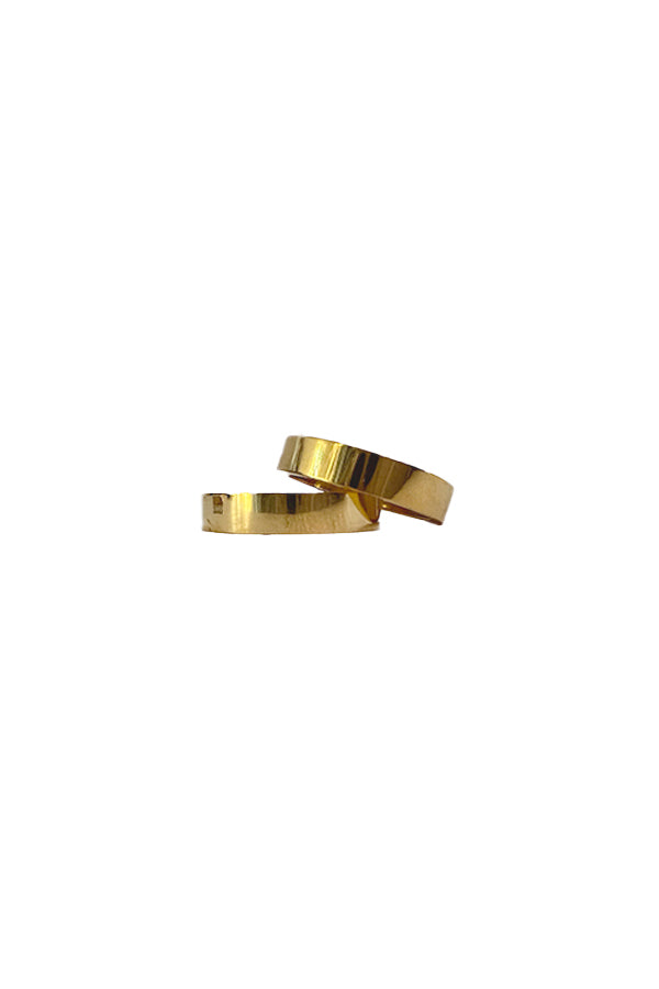 BAACAL - The Flat Band ring.  This one, in the same shiny gold finish.  Modern line with a beautiful weight to it.  Perfect to wear alone or stacked.   A stylish option for almost any occasion or your finishing touch to wear every day. 