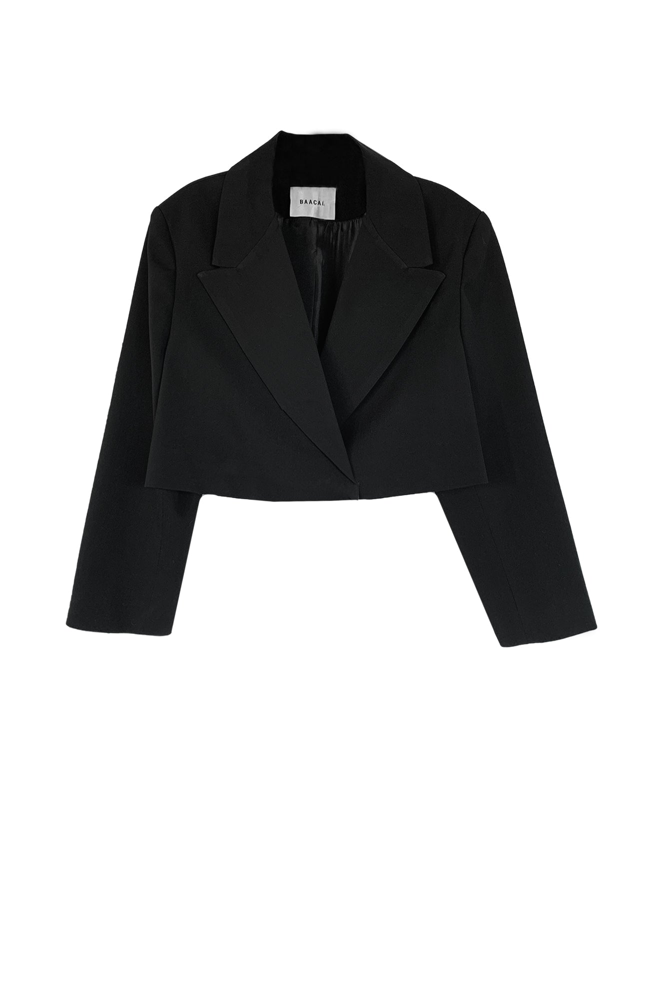 The Crop Blazer is offered here in a rich black. The best Item to update your Fall wardrobe.  Perfect to wear open or closed with inside hidden buttons.