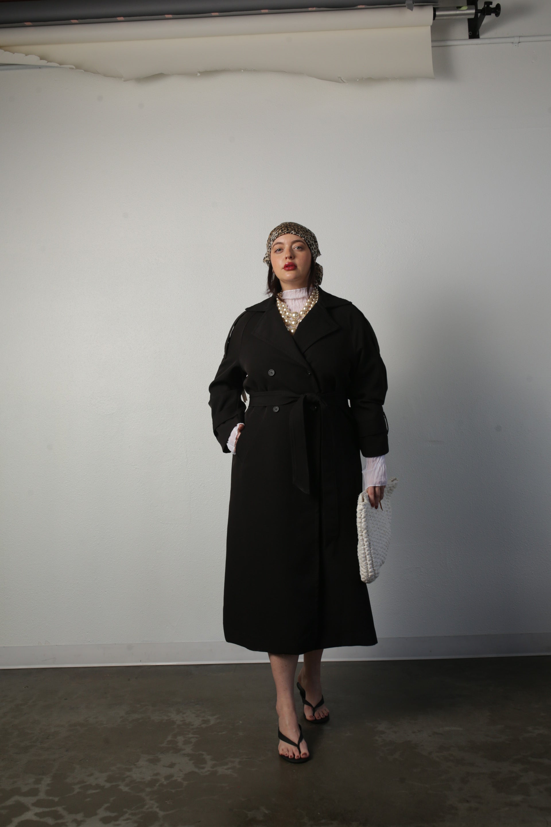 model wearing black aria coat