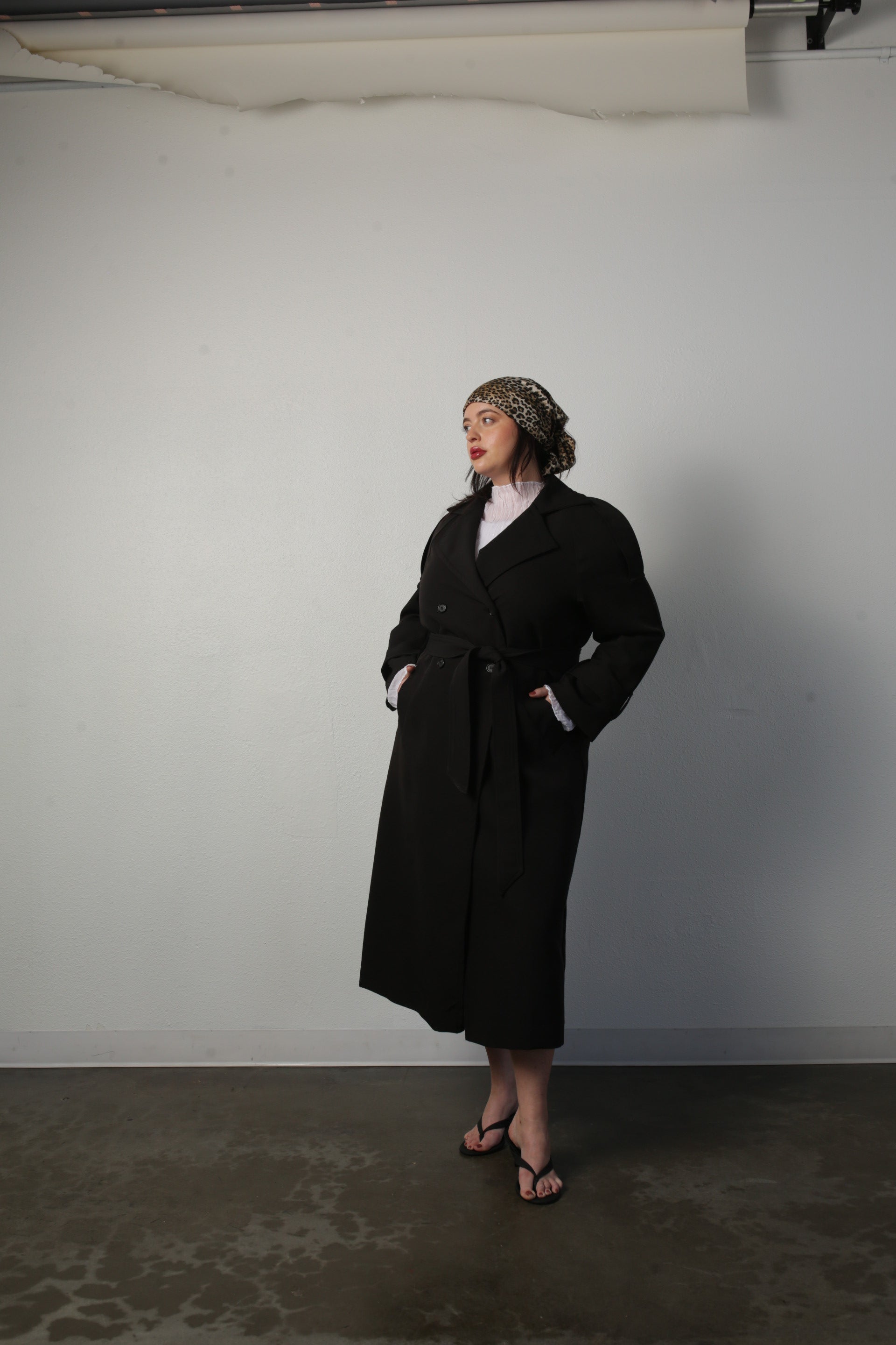 model wearing black aria coat