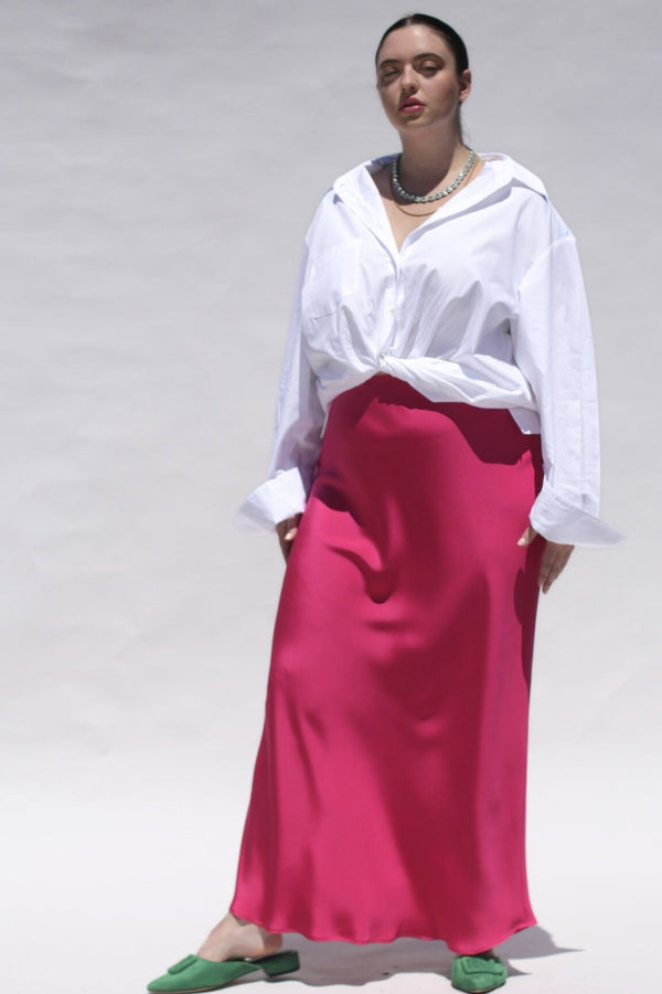This Sapphire Pink silk slip skirt is cut on the bias for a fluid finish and falls elegantly to the ankle. Model Image