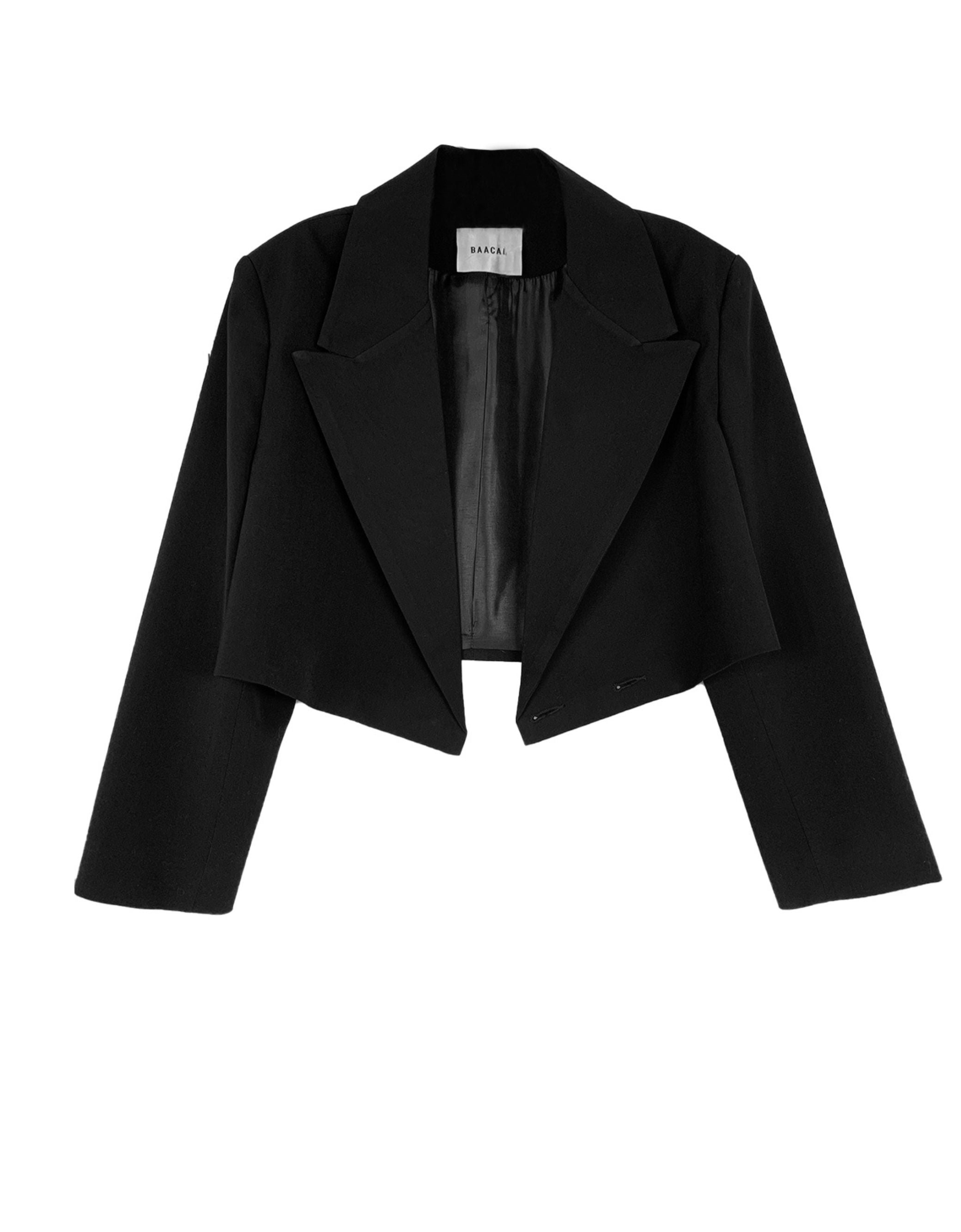 The Crop Blazer is offered here in a rich black. The best Item to update your Fall wardrobe.  Perfect to wear open or closed with inside hidden buttons. 