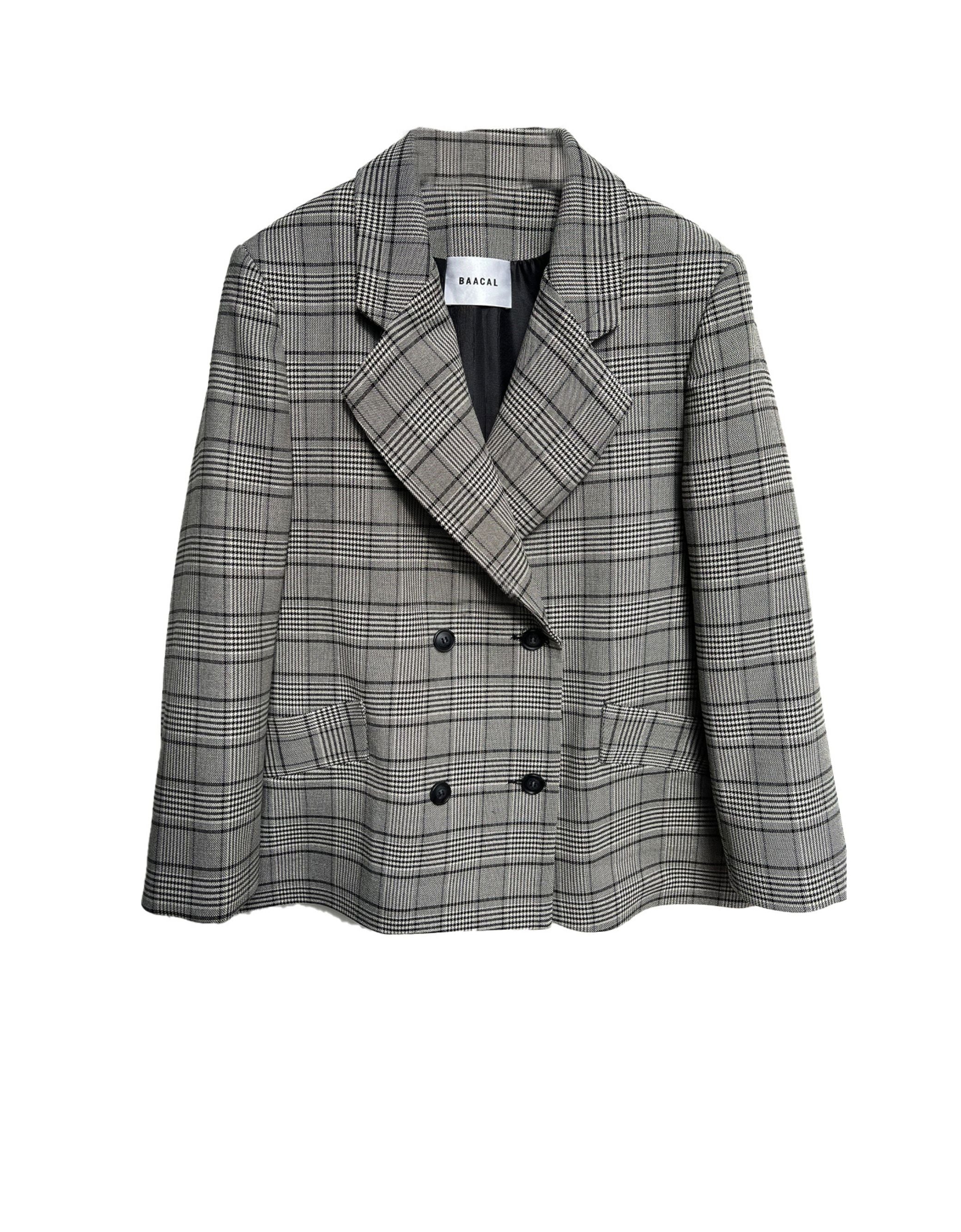 Double Breasted Blazer has a slightly oversized ﬁt.  Looks great open belted or buttoned up.  Made of a lightweight Wool blend, double-breasted with tailored shoulders. A go-anywhere wear any way favorite you will reach for from Fall through Spring. 