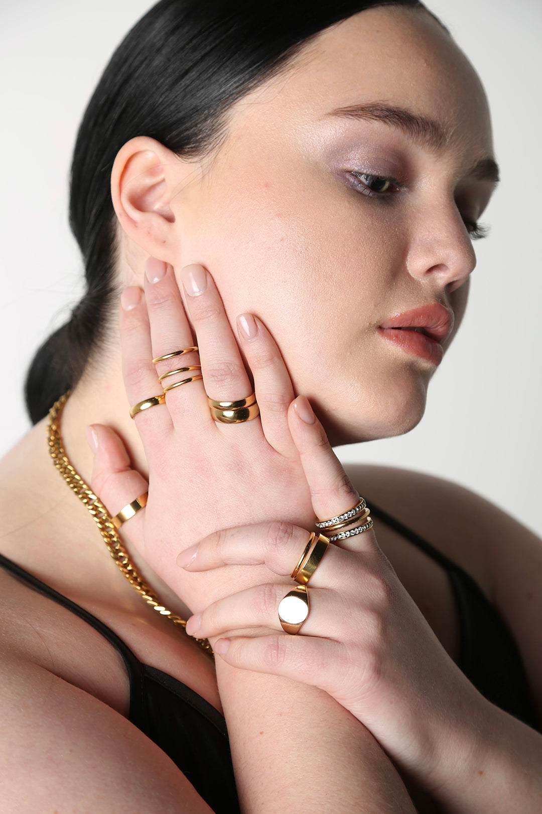 BAACAL thin gold plated stacking rings. Shown on model wearing additional BAACAL jewelry.