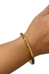 gold bangle on model