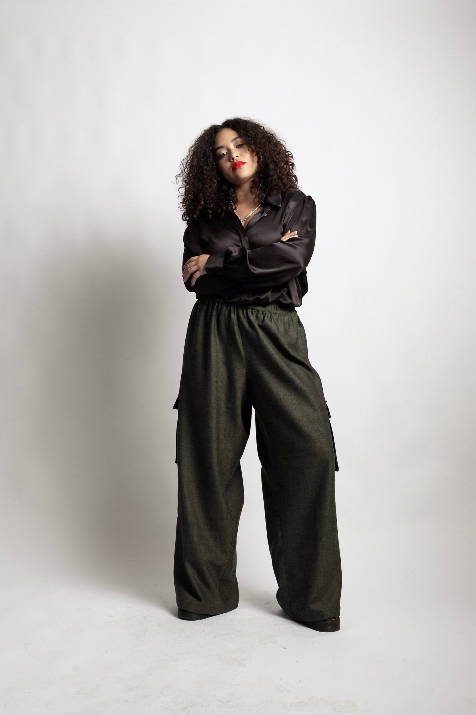 model wearing black Sigourney top and cargo pants