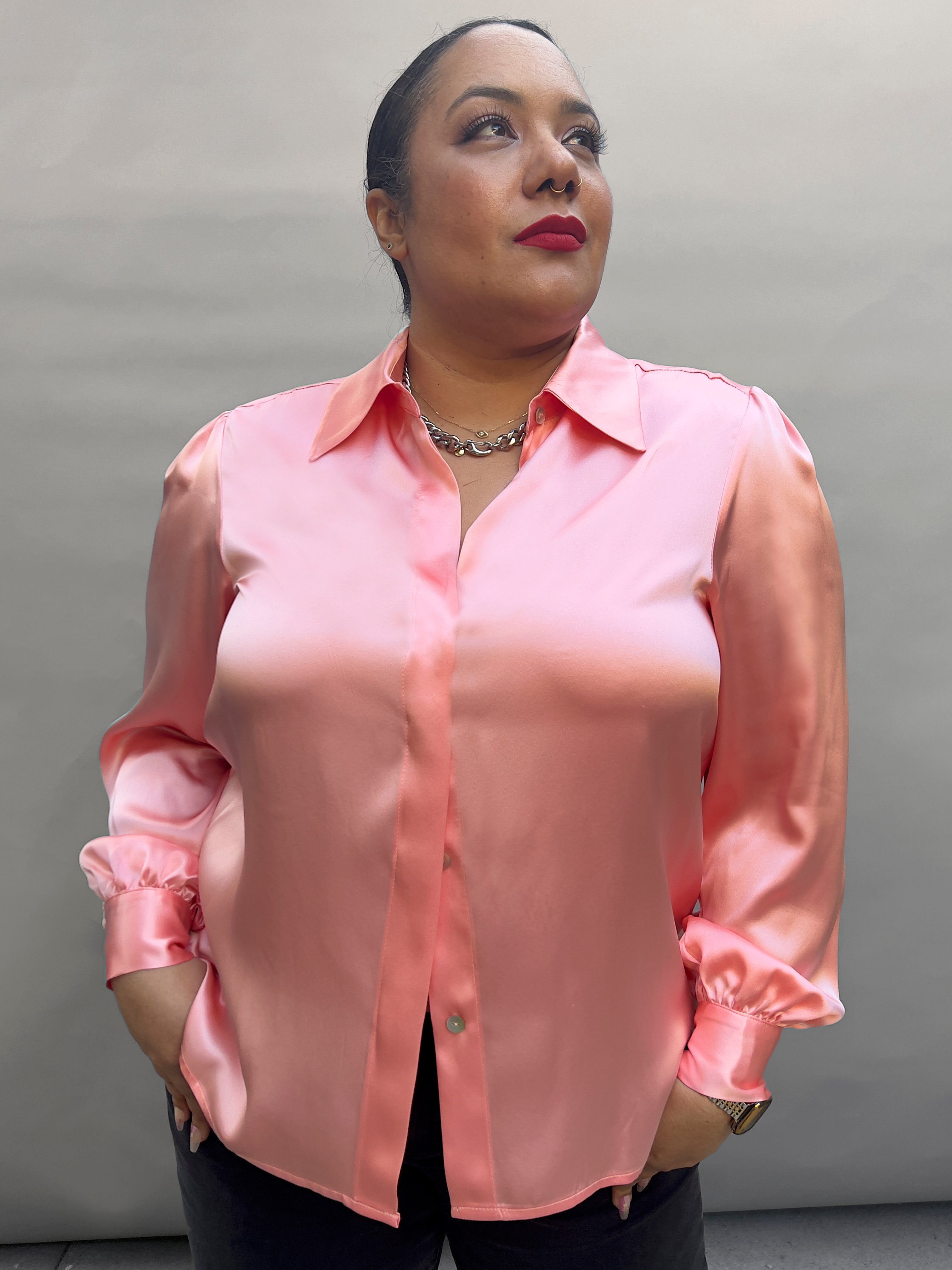Model wearing peach Sigourney blouse
