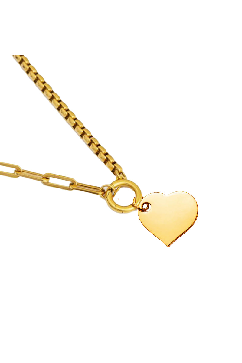 Gold heart-shaped pendant on a gold chain against a white background