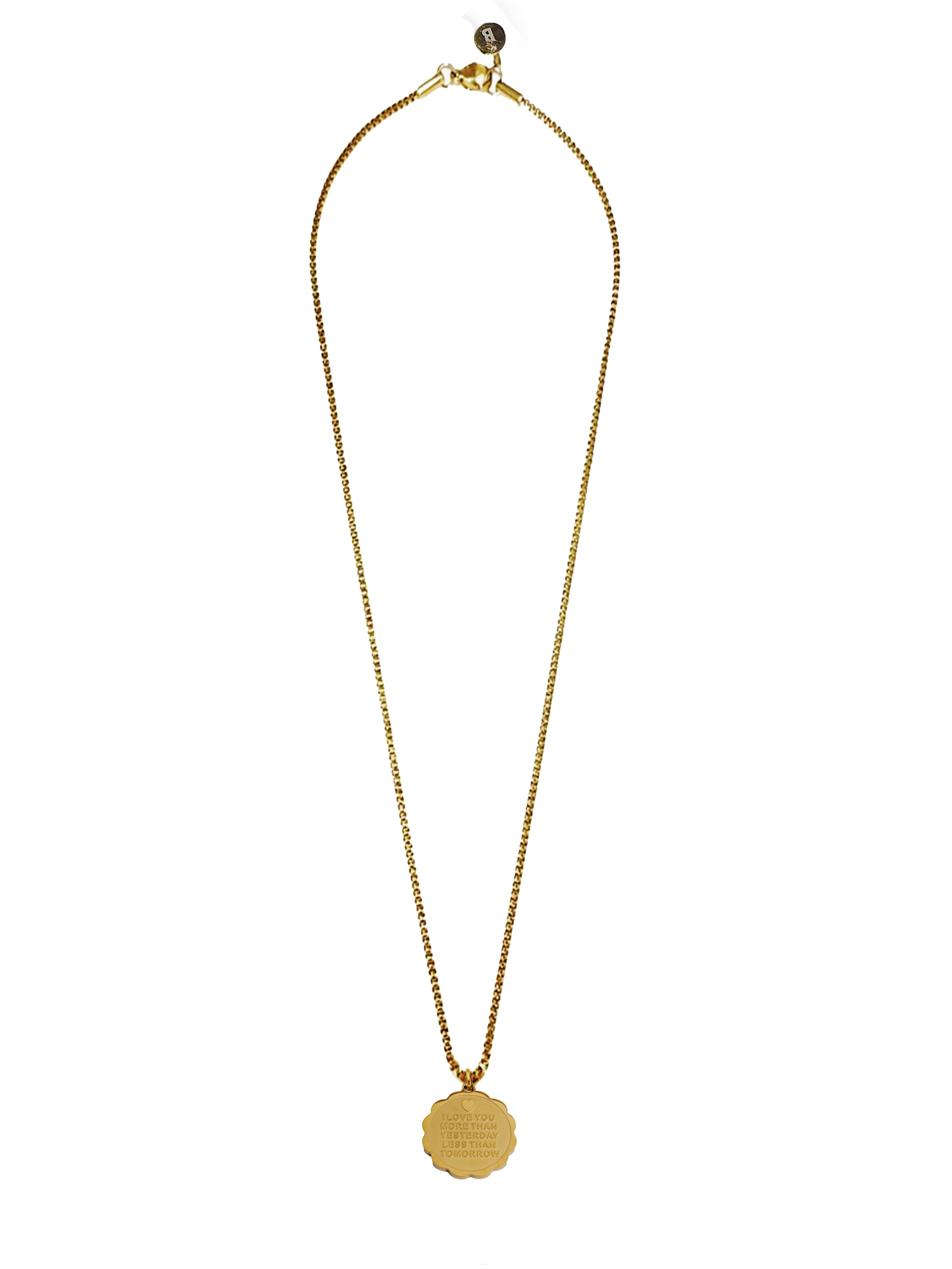 Gold necklace with a round pendant on a white background
