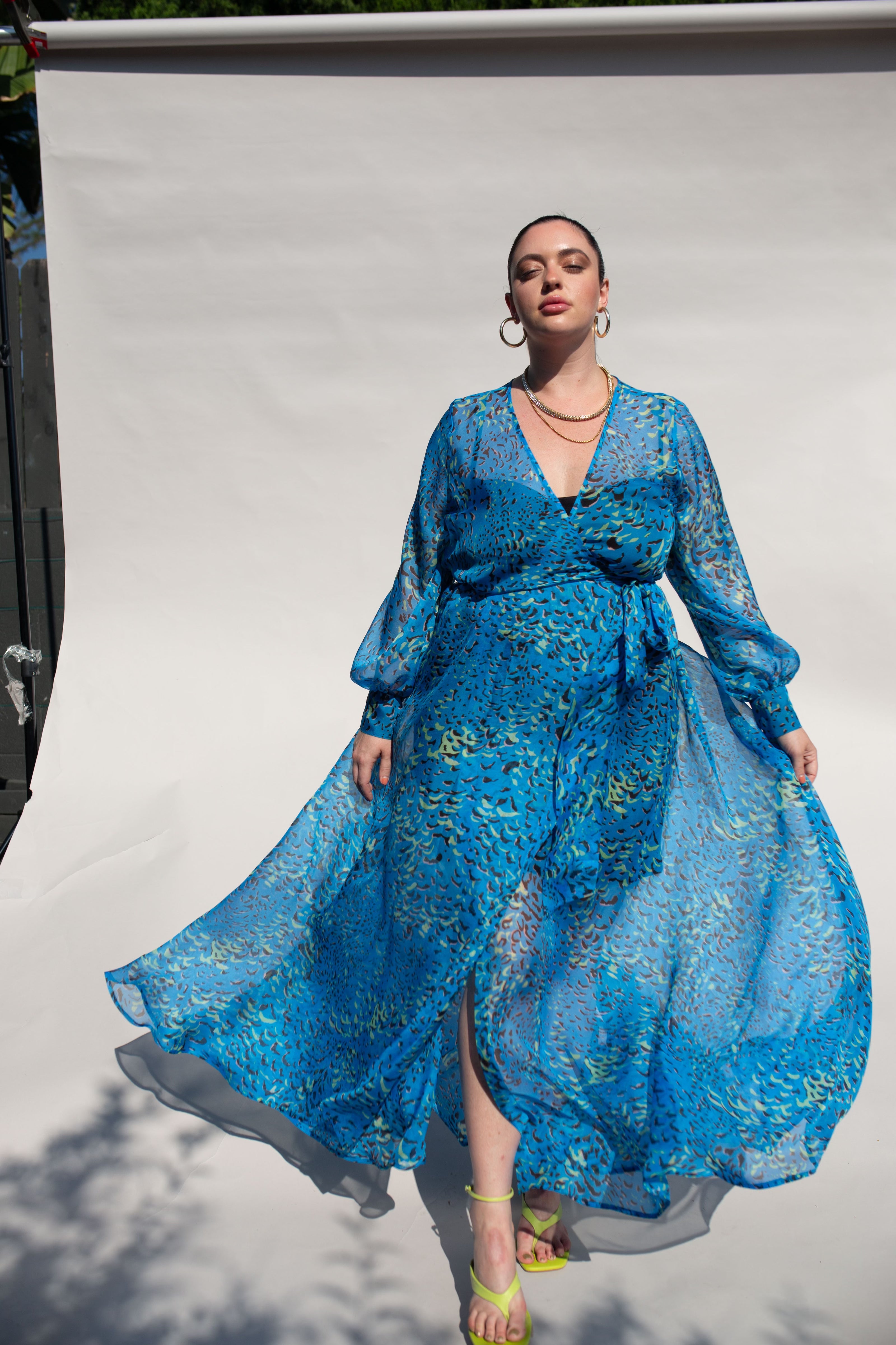 Our best-selling, now classic, maxi wrap dress! The luxurious blue silk chiffon gives this dress a very unique, flowy look. Wear with our navy slip dress or on its own for a sheerly fantastic look. Designed to fit the "True Size Majority" sizes 10-22+