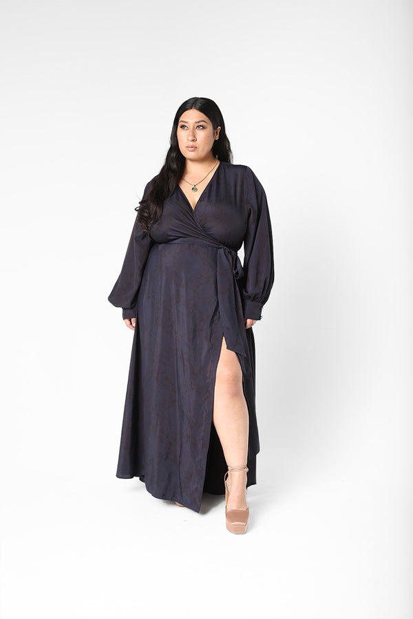 Our best-selling now classic maxi wrap dress! This one is washed and over-dyed with an ink-blue color.  A faint floral print shows through Ink blue giving this dress a very unique look. Designed to fit the true size majority - sizes 10-22+