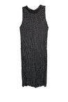 Black sleeveless dress with white polka dots on a white background
