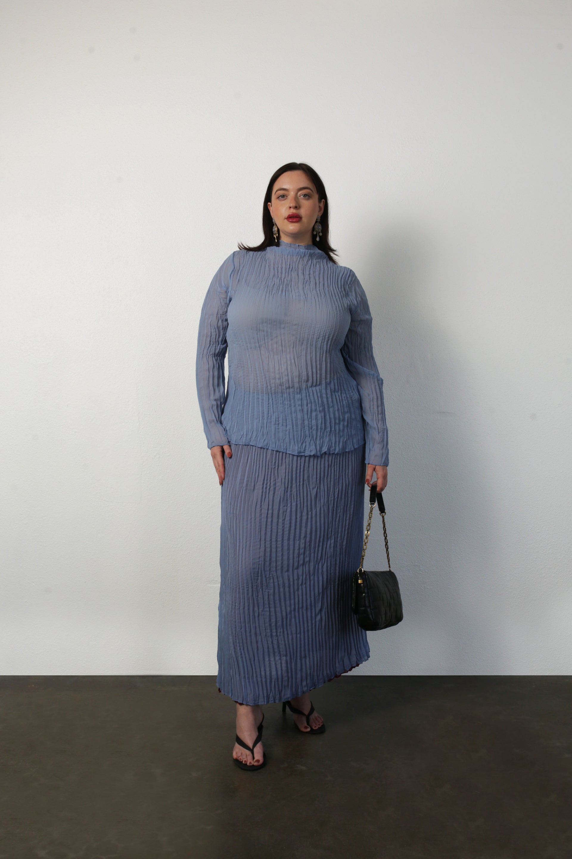 model wearing coppen blue Esme top and rue skirt