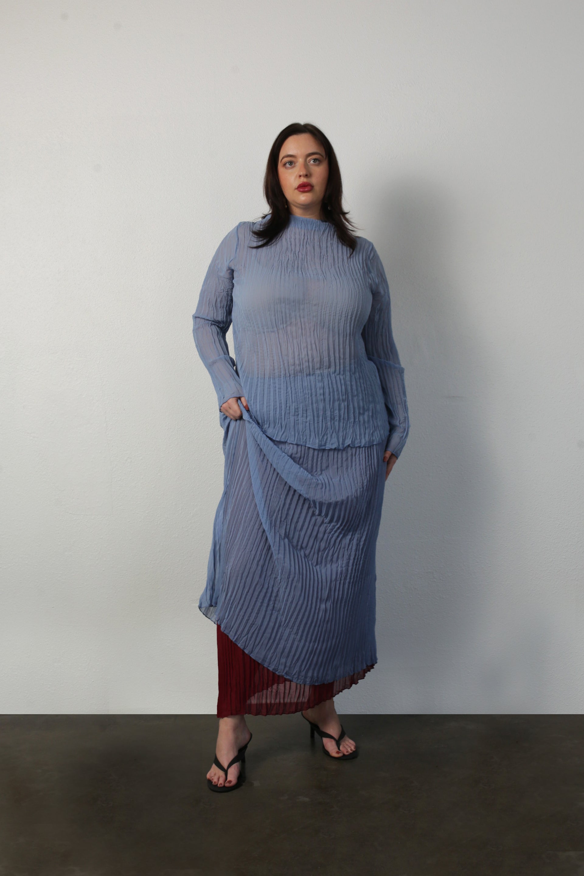 model wearing coppen blue Esme top and rue skirt