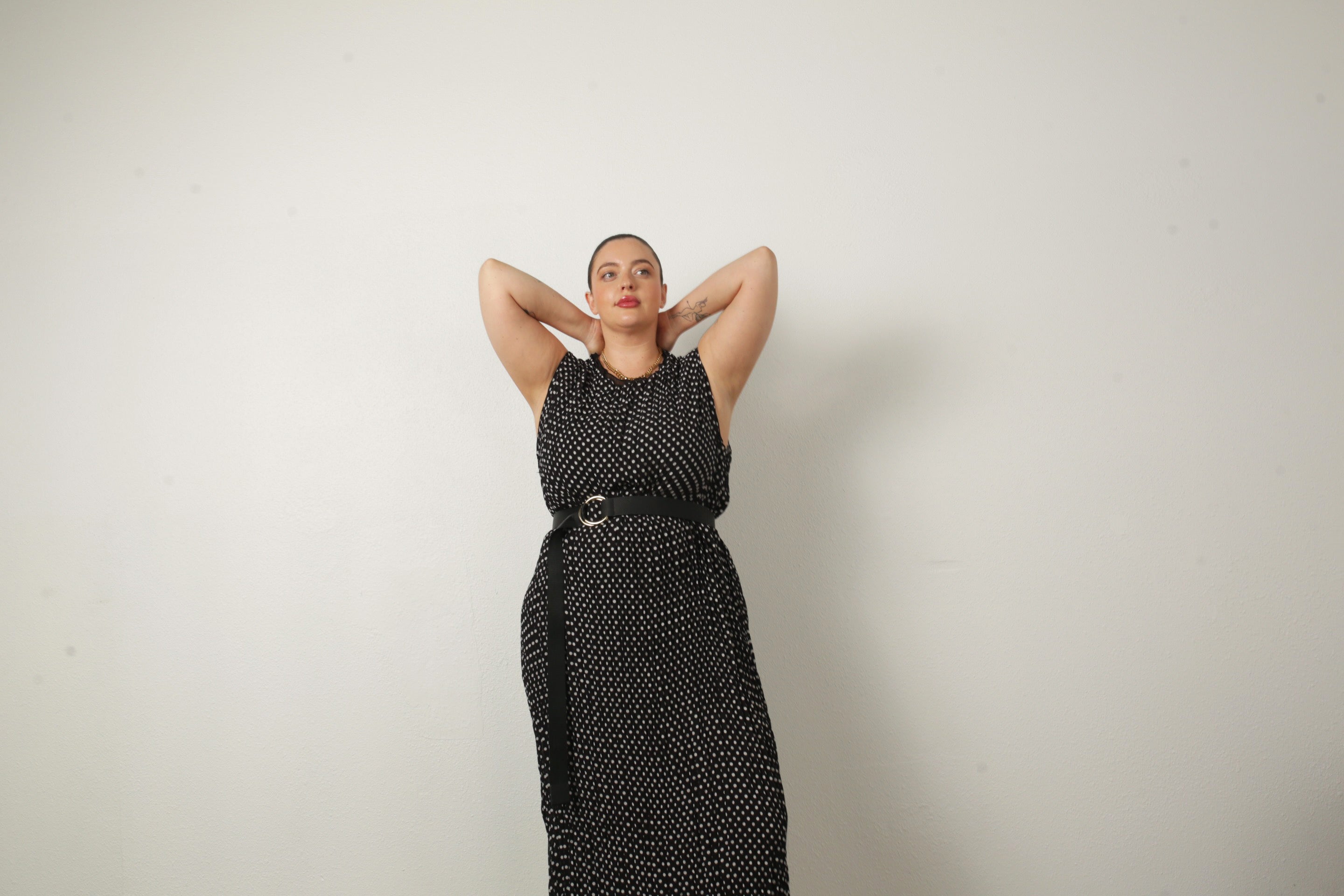 model wearing jaya dress with arms up