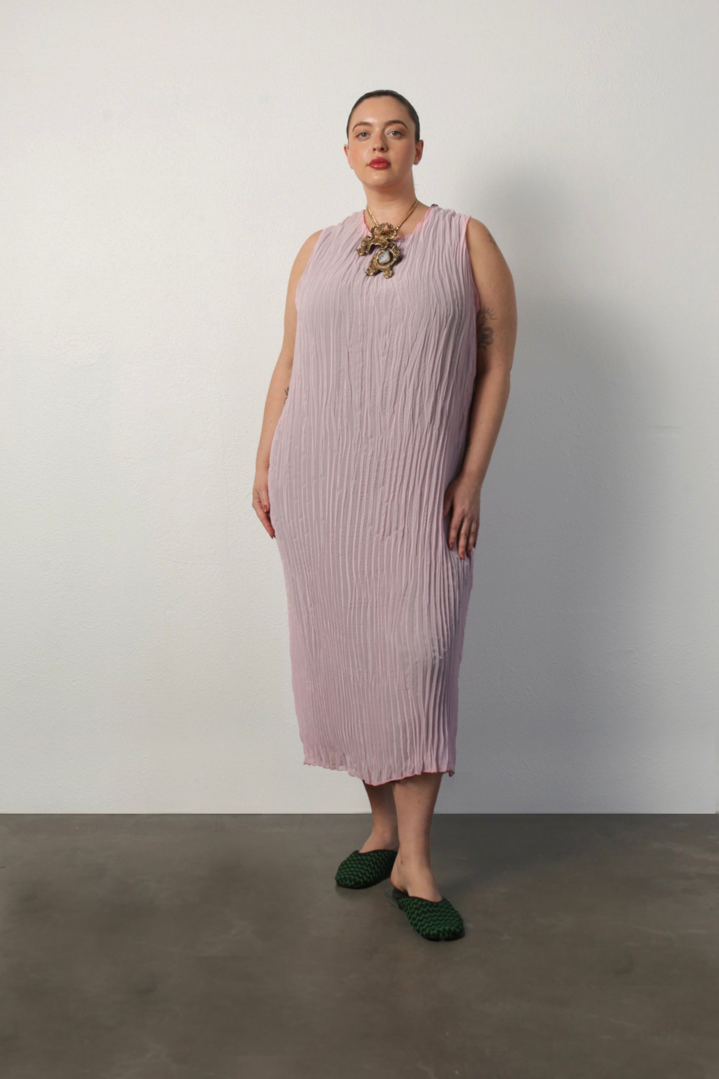 model wearing the jaya dress on the pink side