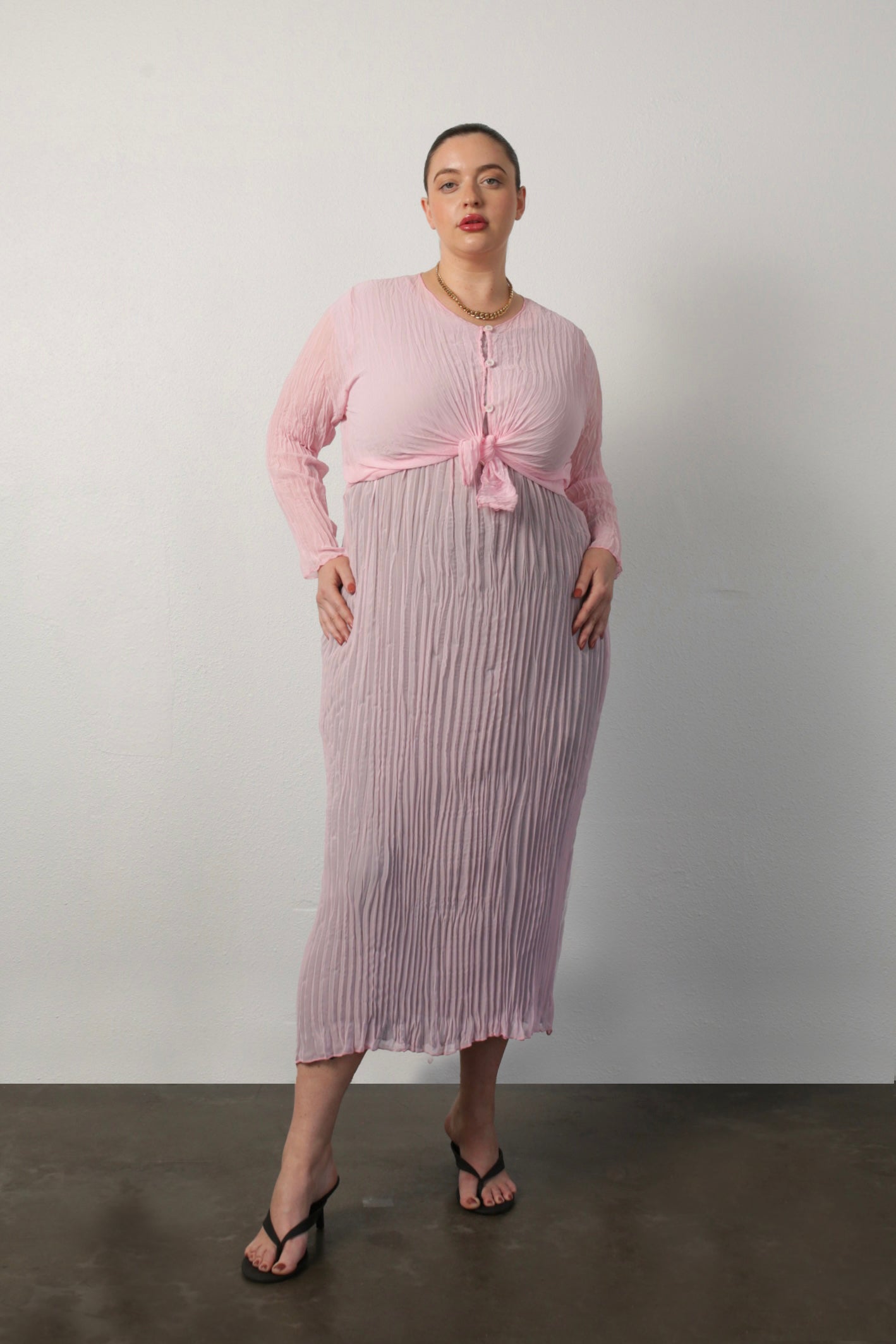 plus size model wearing jaya dress and Maya Cardi tied in pink