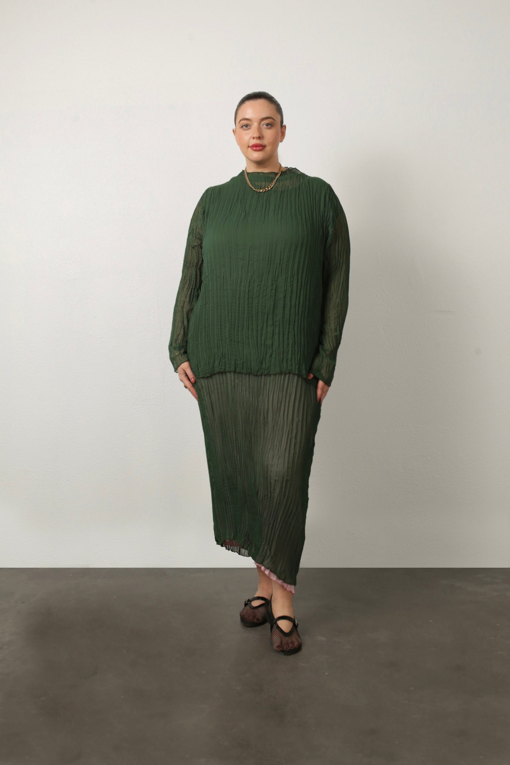 model wearing green Esme top and green jaya dress