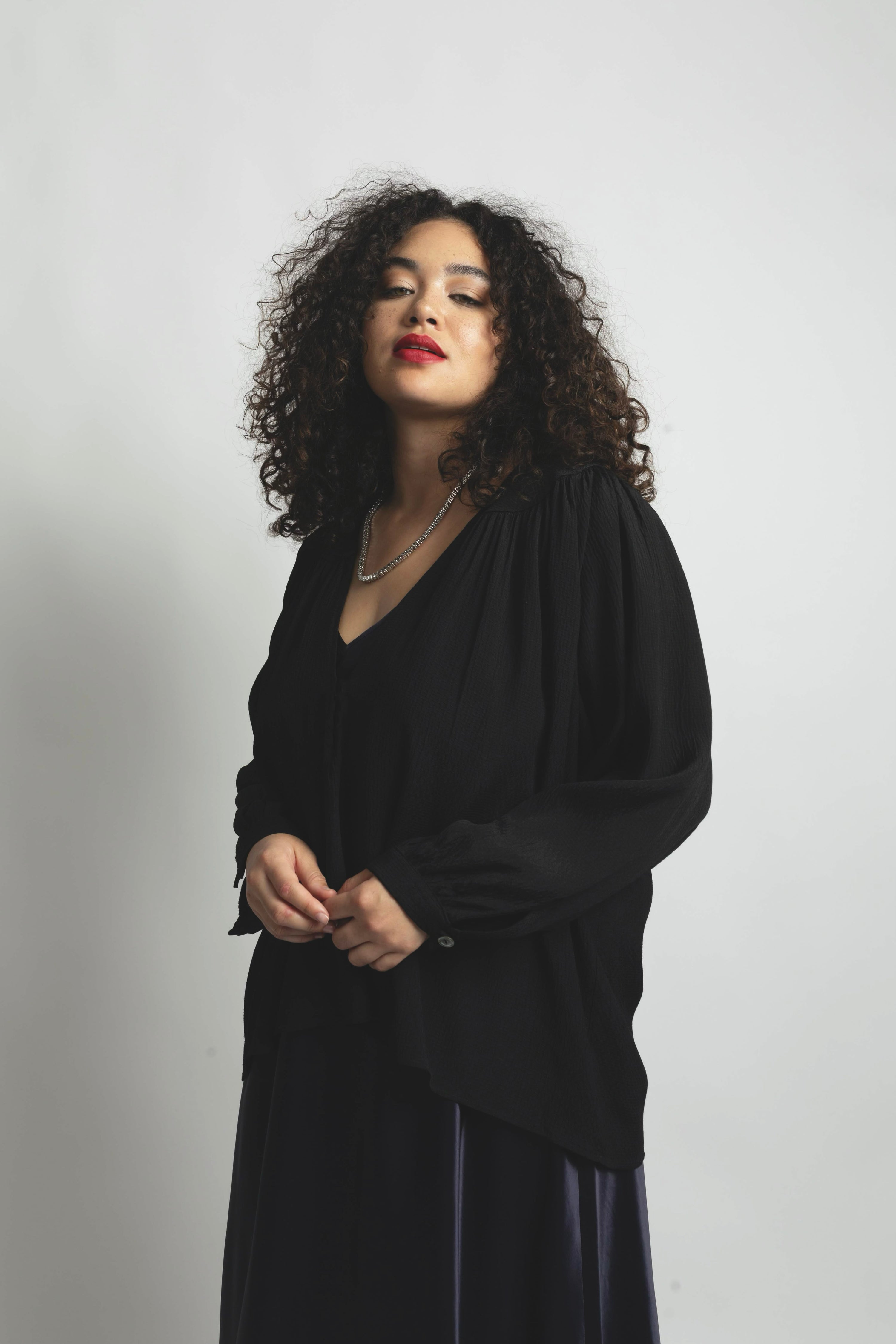 Plus size model wearing textured Stevie top