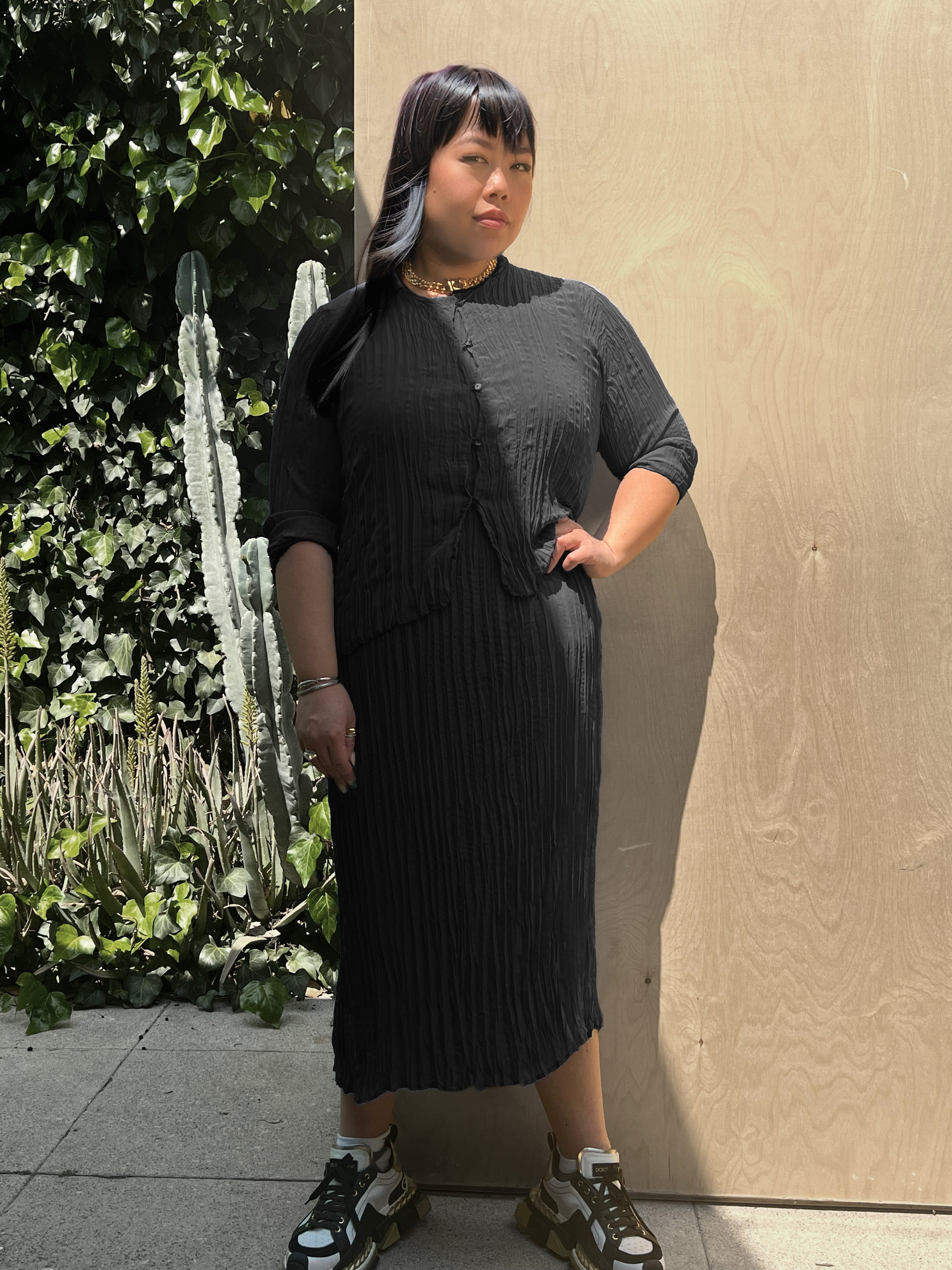 model wearing the pleated cardigan and dress