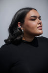 chunky hoop earrings on plus size model