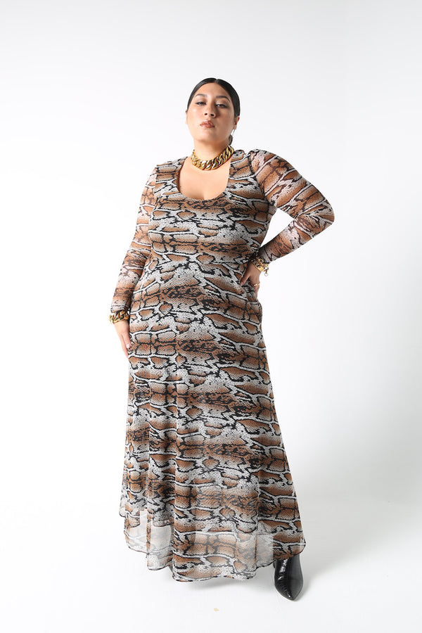 The Graham mesh dress. This double mesh midi dress is here in a rich snake print. Details include a deep ballet neckline, high waist seam, and pockets. The front body and skirt are doubled with sheer sleeves and back. Designed to fit by BAACAL Cynthia Vincent for "The True Size Majority" sizes 10-22.