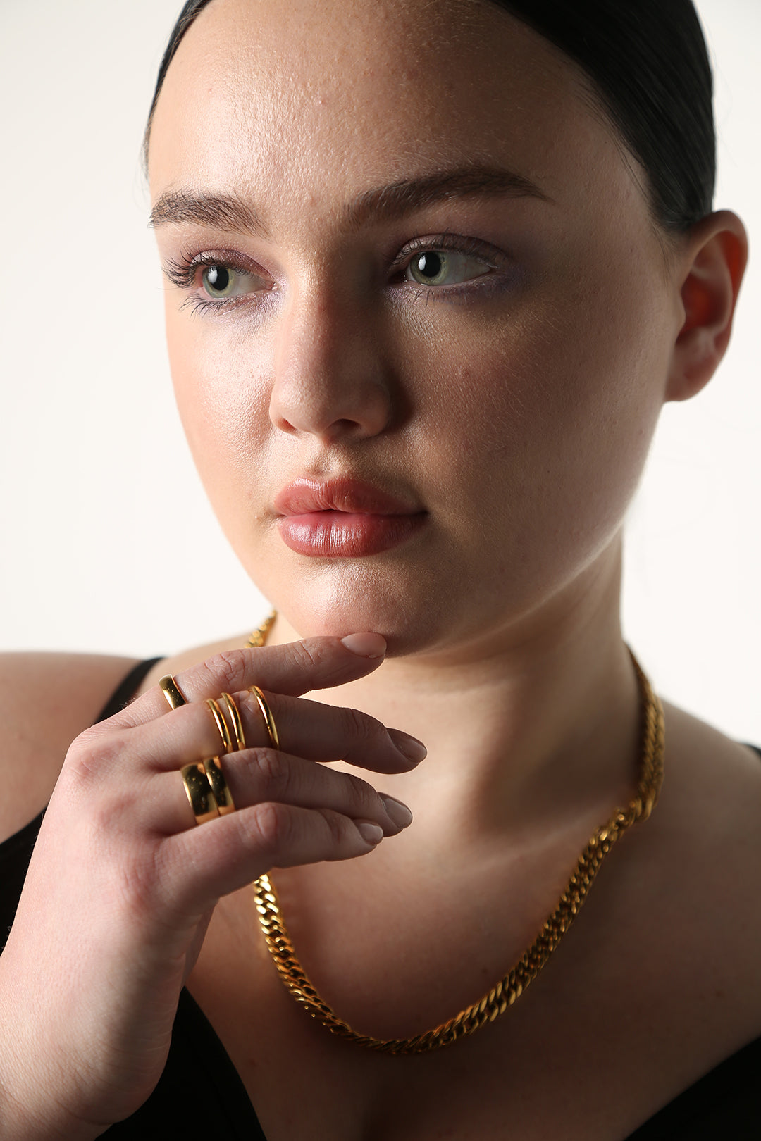 BAACAL Gold Wide Bank Stacking Ring - 8mm - A timeless, stacking piece with a deep gold shine. Perfect to wear alone or stacked.   Perfect for almost any occasion or your everyday finishing touch to your outfits.  Shown on model with other BAACAL jewelry.