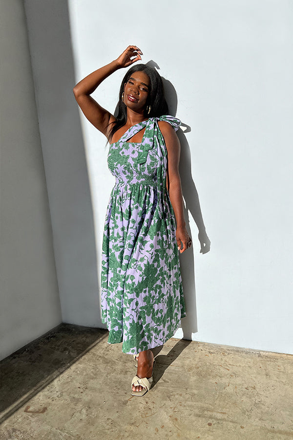 Style and comfort has never felt and looked so good! This laid back and cool floral maxi dress will be the one season after season. With a full smocked bodice this dress fits and flatters most all body types and has an extensive range of sizes, giving you the perfect fit and making it your go to for any occasion. The tie straps allow you to easy adjustability. 