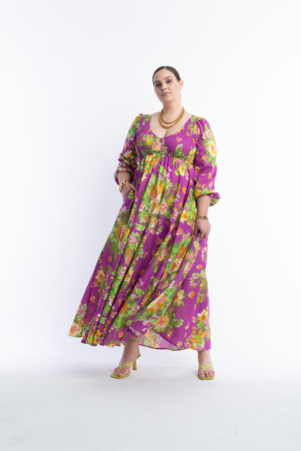 Shown on Model - Style and comfort has never felt and looked so good! Perfect for everyday and special occasions - this super easy breezy floral maxi dress will be your favorite season after season. With a fully smocked bodice, The Joni fits and flatters most all body types. Available in an extensive range of sizes.  