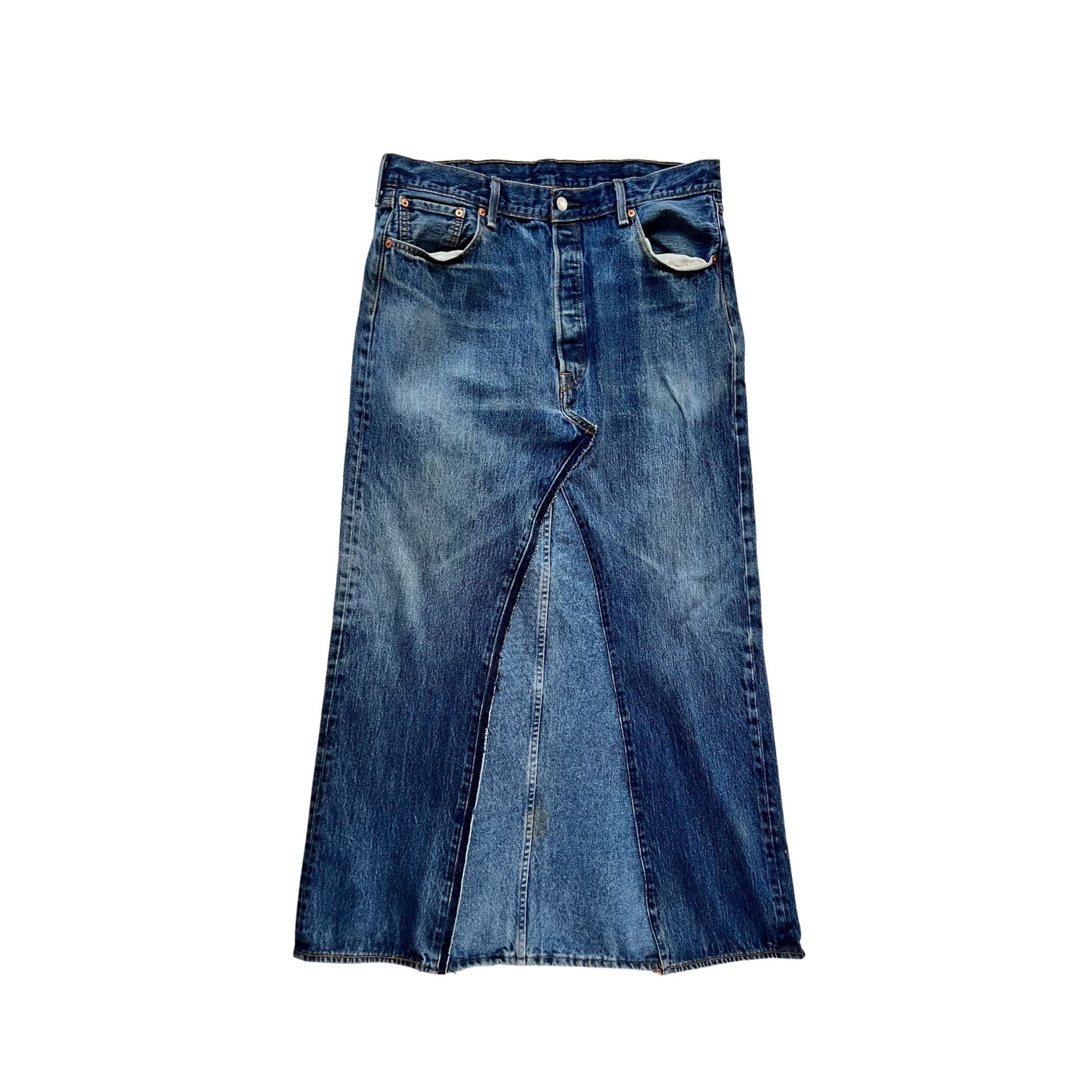 This Denim maxi is the ultimate in street smart style. Made with up-cycled jeans.  Every skirt is hand constructed from two pairs of jeans, making each piece unique and one of a kind.   Totally authentic and sustainable to