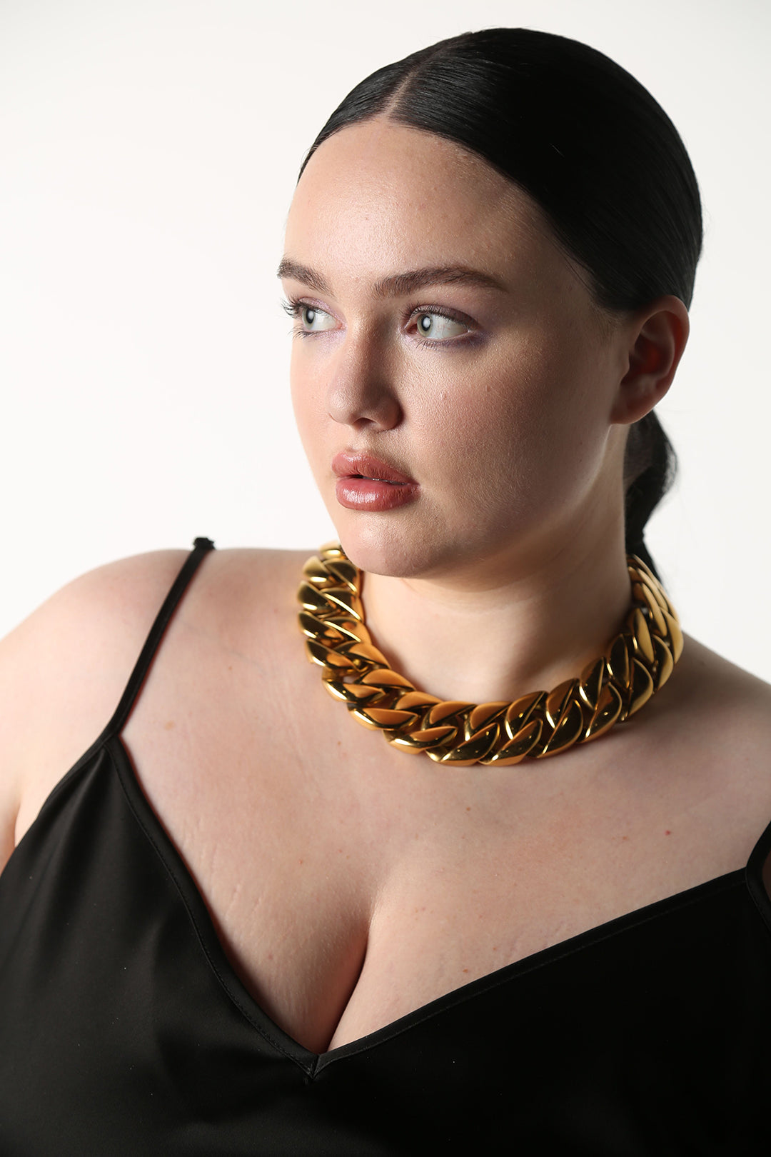 This is the Mac Daddy of Cuban Link necklaces.    A timeless, bold statement piece with a deep gold shine.   A timeless, statement piece with a deep gold shine. Perfect for almost any occasion or your everyday finishing touch to your outfits. measures 22” long 