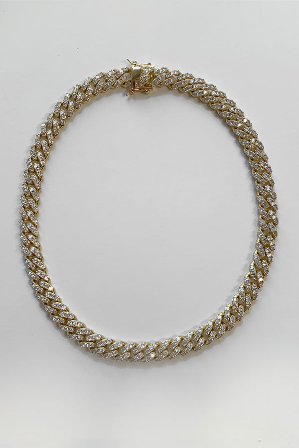 BAACAL - Icy Cuban Goldlink Choker - Our signature Cuban Link necklace now comes in pave! -Weighty with a beautiful 18K gold color. -Made of stainless steel with a gold finish A timeless, statement piece necklace with a deep gold shine. Perfect for almost any occasion or your everyday finishing touch to your outfits. Available 20" in length 18" in length