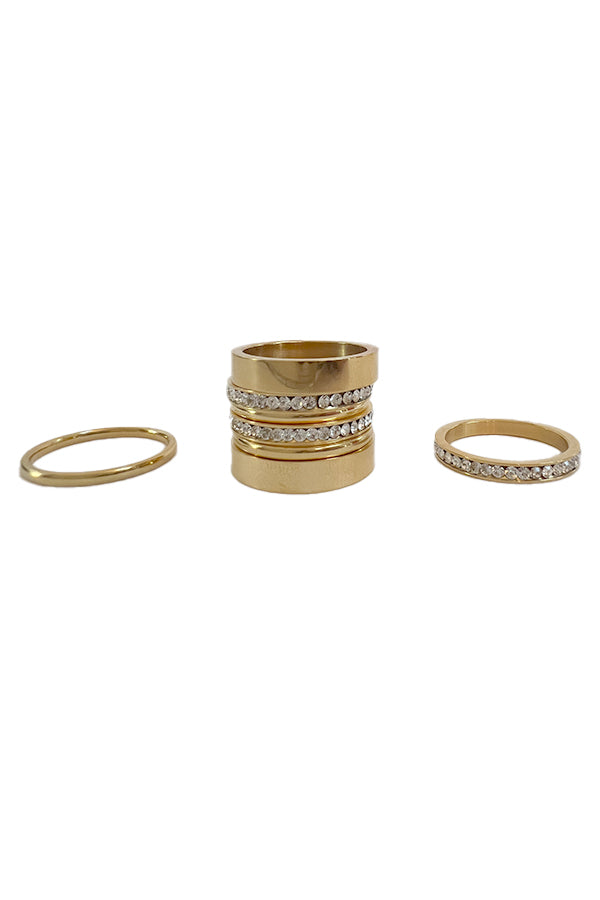 BAACAL - The Flat Band ring.  This one, in the same shiny gold finish.  Modern line with a beautiful weight to it.  Perfect to wear alone or stacked.   A stylish option for almost any occasion or your finishing touch to wear every day. Shown with other rings