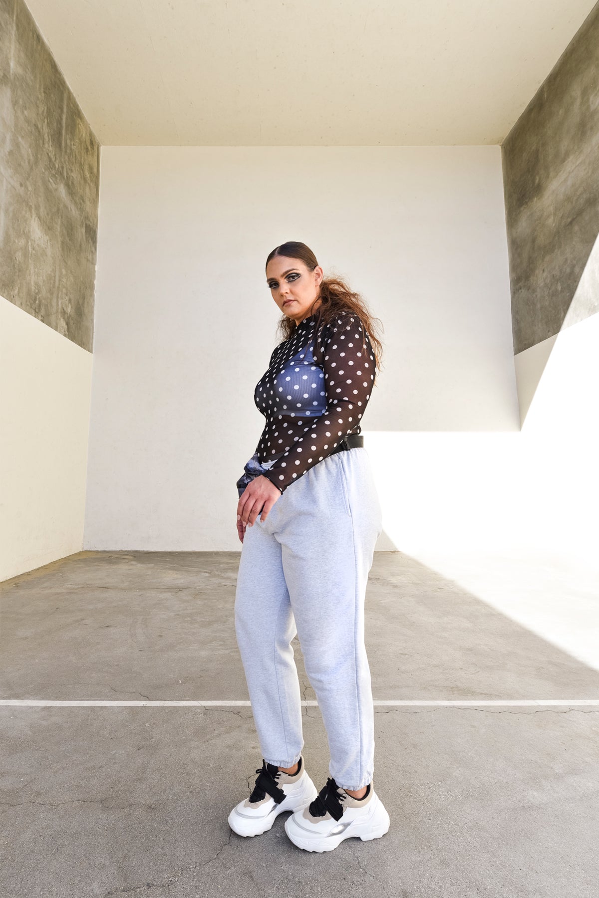 Playful White on Black dotted semi sheer mesh long sleeve top